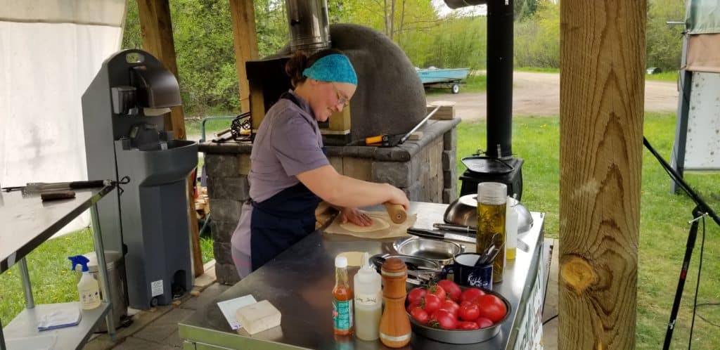 Kara making pizza