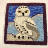 hooked snowy owl