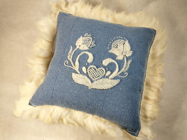 embroidered sheepskin pillow blue