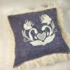 purple embroidered pillow