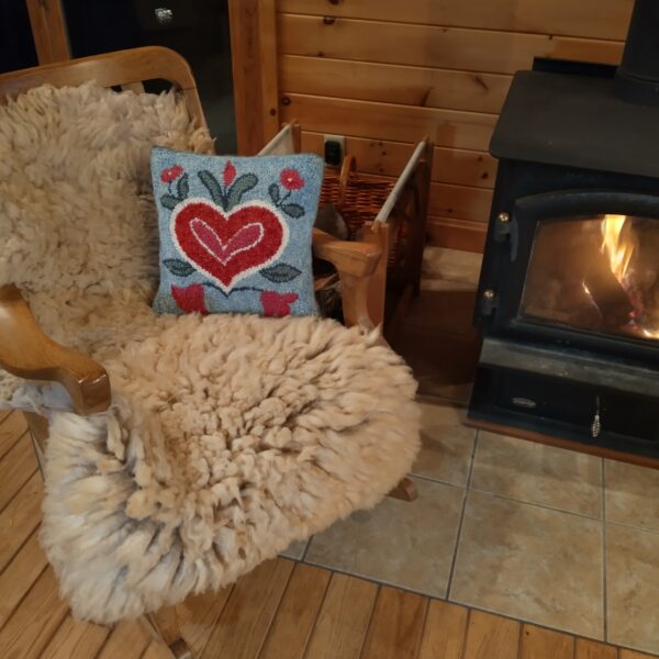 cream cushy on chair